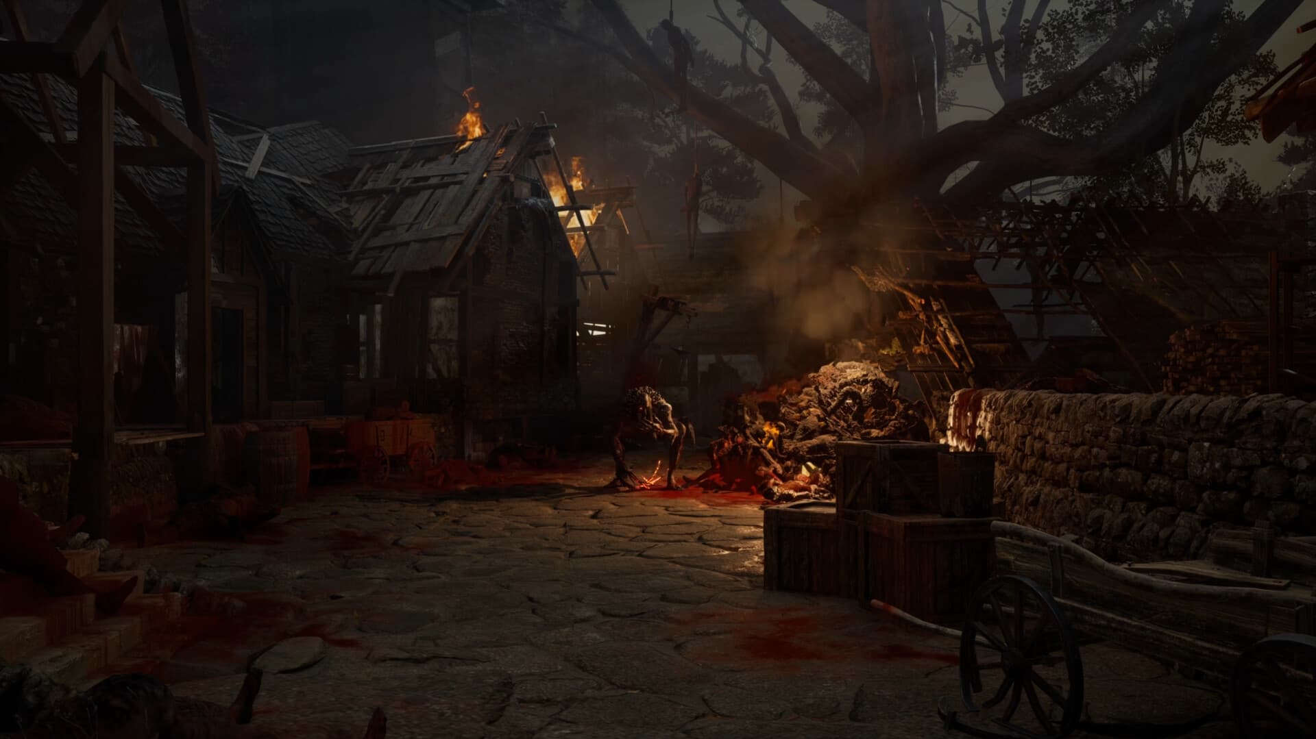 Fire and corruption glow beside buildings on a dark village street.